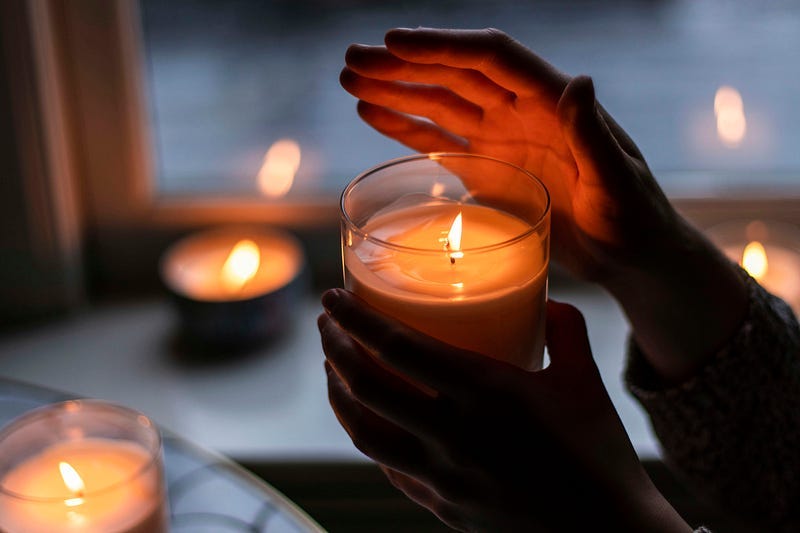 hands holding candles hands holding candles