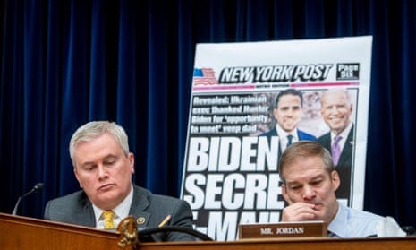 Two men with a blown up copy of the New York Post behind them