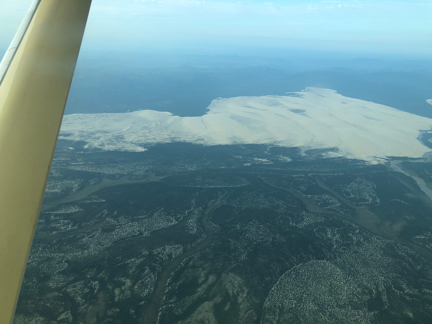 View of the Great Kobuk Sand Dunes from an airplane window.