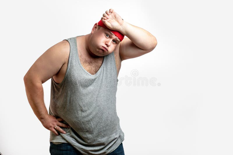 Overweight Man Tired after Training, with Hand on Forehead Against ...