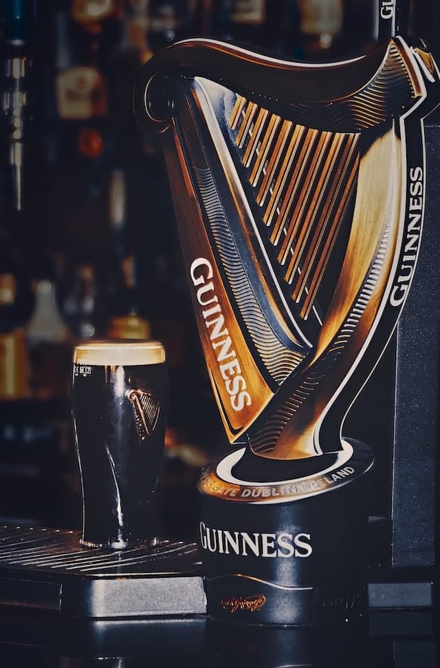 Celtic Harp Guinness logo next to a pint of Guinness