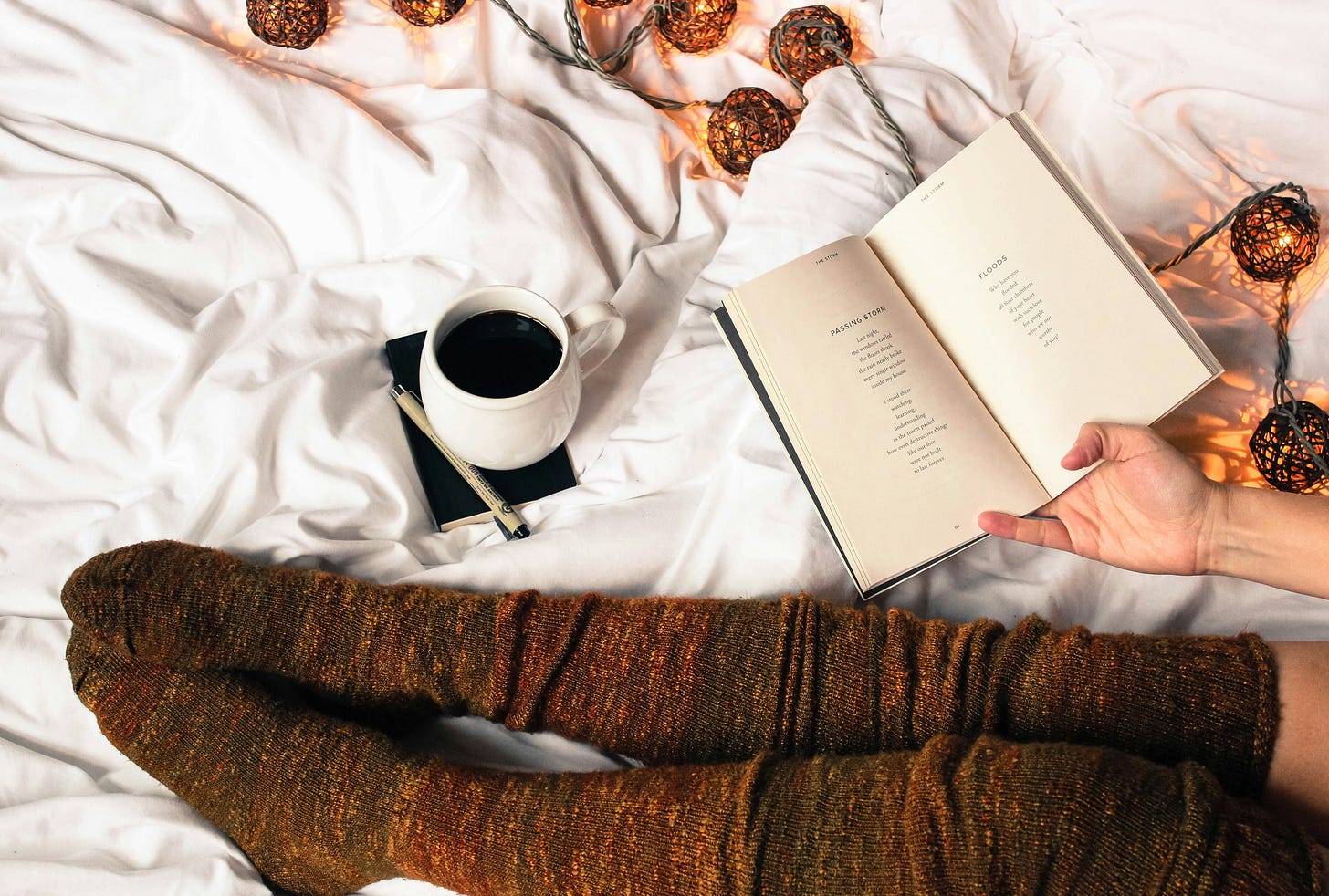 picture of feet in socks, coffee, and a book with fall colors picture of feet in socks, coffee, and a book with fall colors