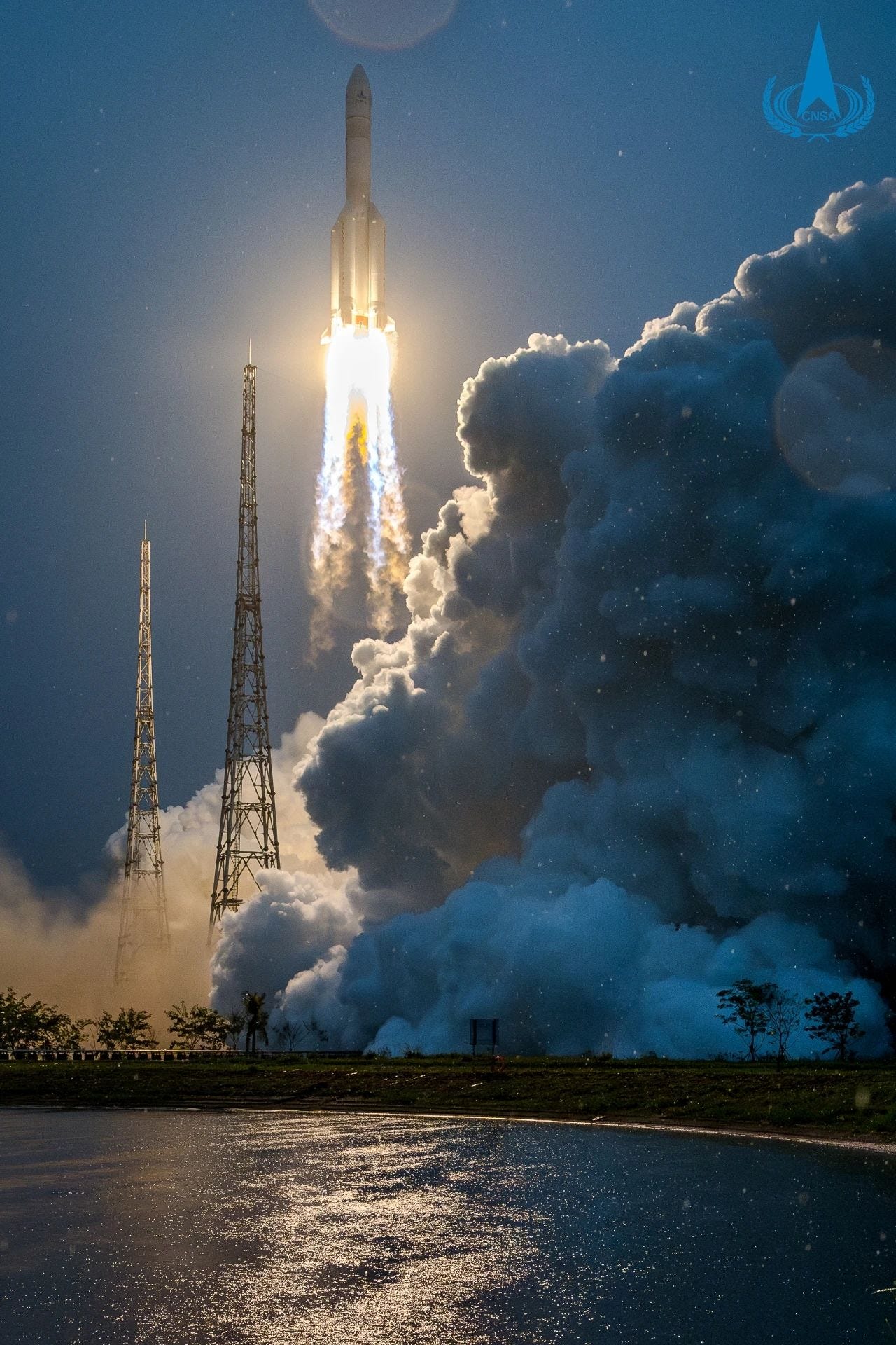 The Long March 5 Y8 vehicle lifting off from the Wenchang Space Launch Site carrying Chang’e 6 through heavy rain.