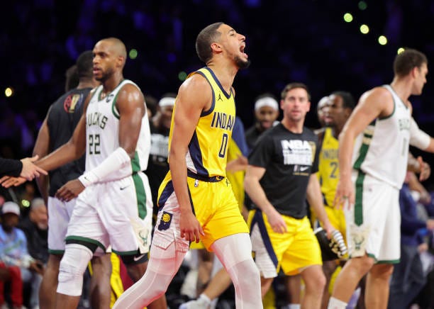 Tyrese Haliburton of the Indiana Pacers reacts after hitting a 3-pointer against the Milwaukee Bucks in the second half of the East semifinal game of...