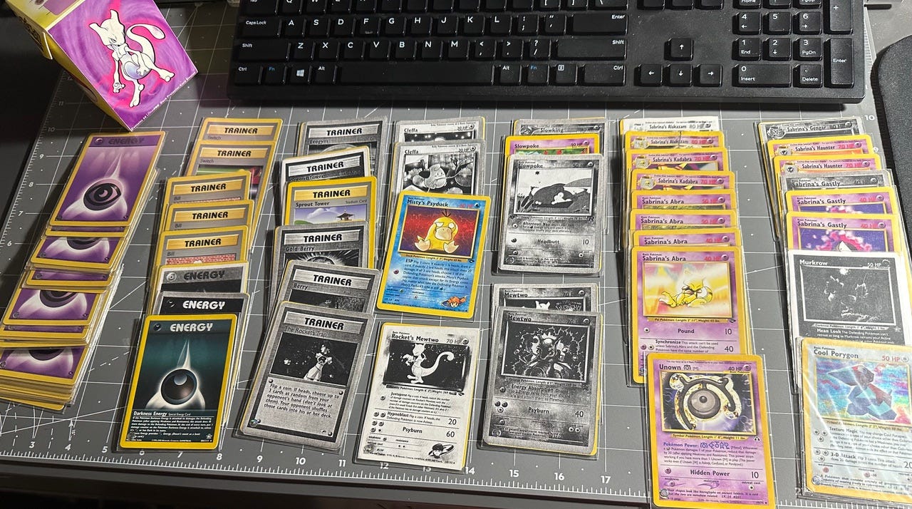 Greg shared a photograph of his deck that he used during the Super Trainer Showdown event. Some of the cards are in his collection binder, so proxy cards are present in this photograph