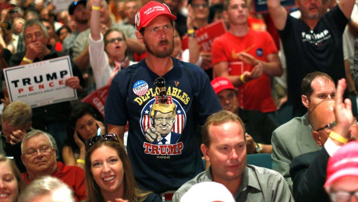 A man reacts as supporters cheer for Republican presidential nominee Donald Trump at a campaign rally in Toledo, Ohio, U.S., September 21, 2016. REUTERS/Jonathan Ernst - RTSOU9M