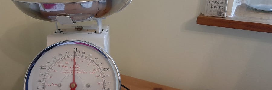 kitchen scales on a wooden table