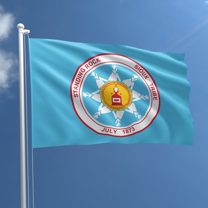 May be an image of banner, flag and text that says 'ROCK STANDING SIOUX Y TRIBE CCCCCC JULY 1873'