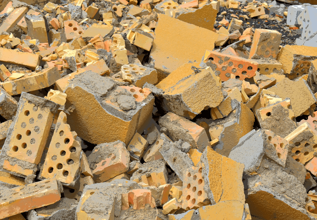 A jumbled pile of shattered and broken yellow bricks