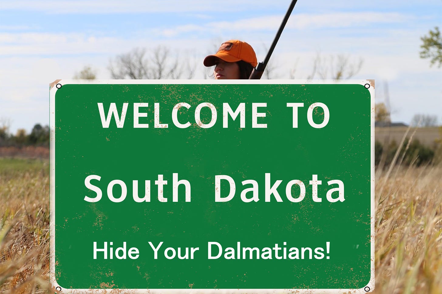"Welcome to  South  Dakota" sign. Governor Kristi Noem lurks behind the sign, rifle in hand.