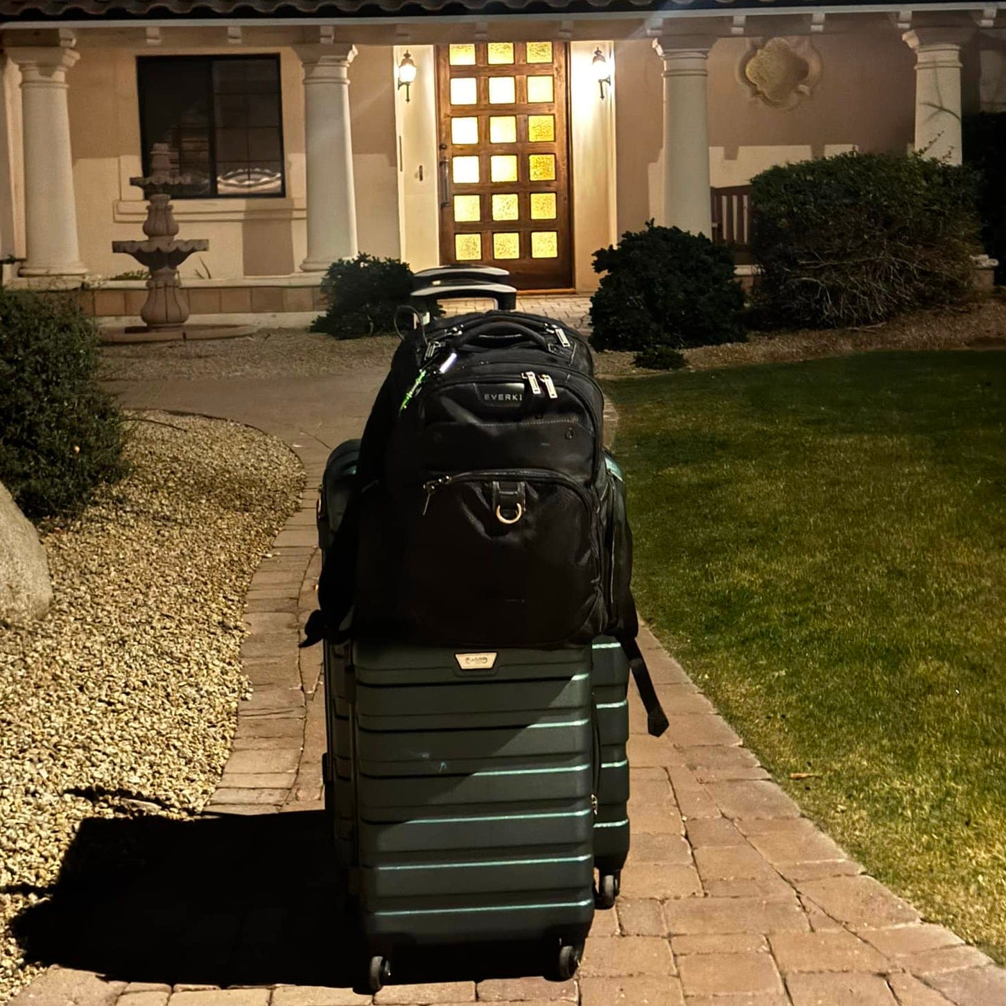 May be an image of golf, golf cart, suitcase and golf course