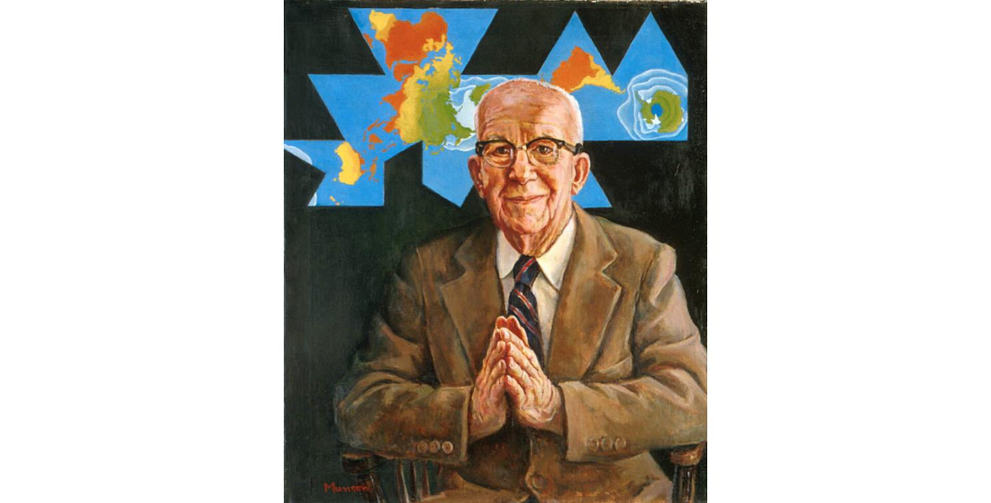 Buckminster Fuller pointing both hands forward