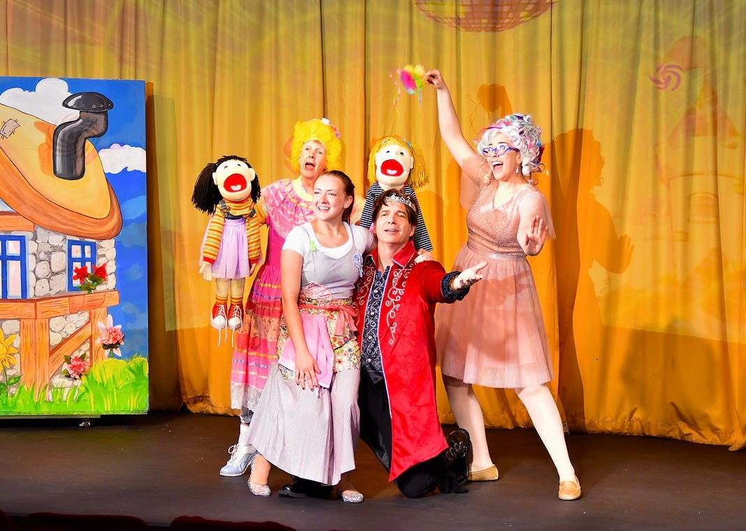 Actors on stage performa a fairytale scene