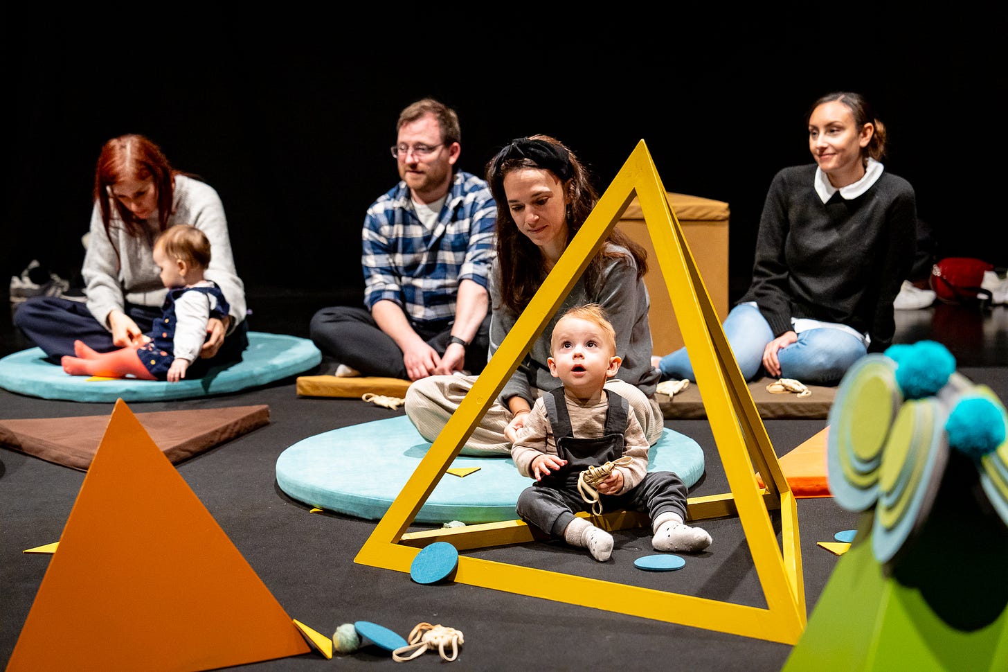 Parents and babies watch a performance of Soft and Spiky at Polka Theatre