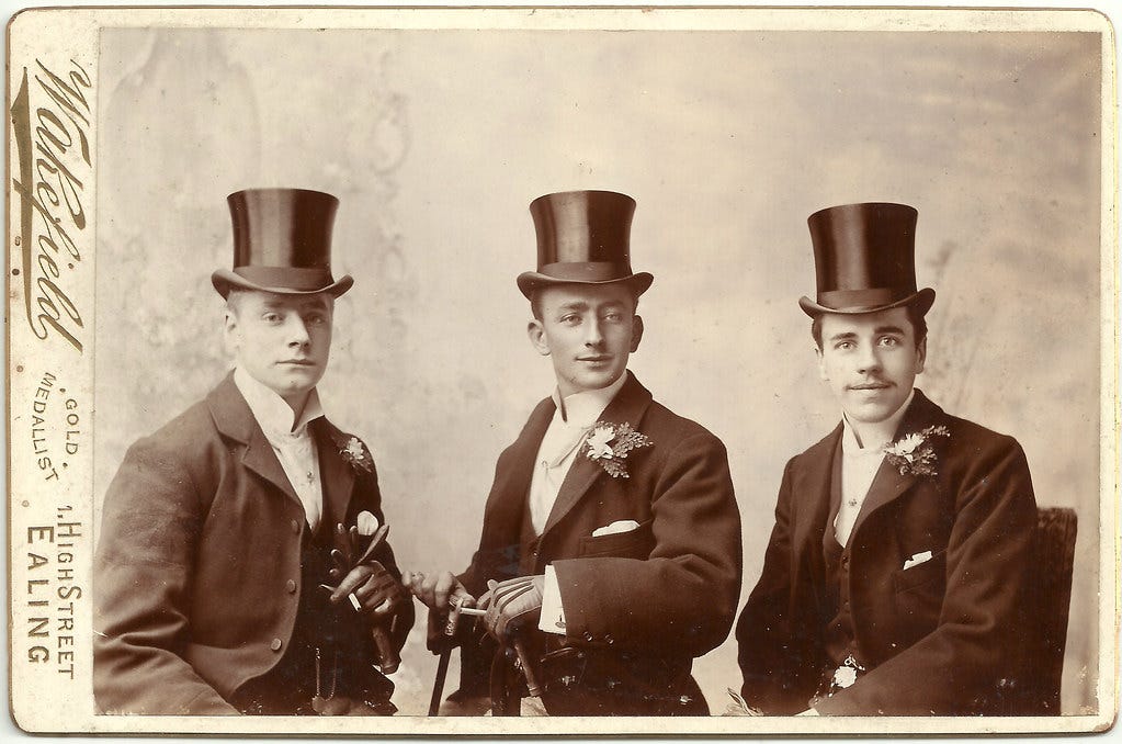 Three men in top hats and suits, clearly and old photo. "Unknown men in top hats (groom and ushers?) by Wakefield, 1 High Street, Ealing" by whatsthatpicture is marked with Public Domain Mark 1.0. 