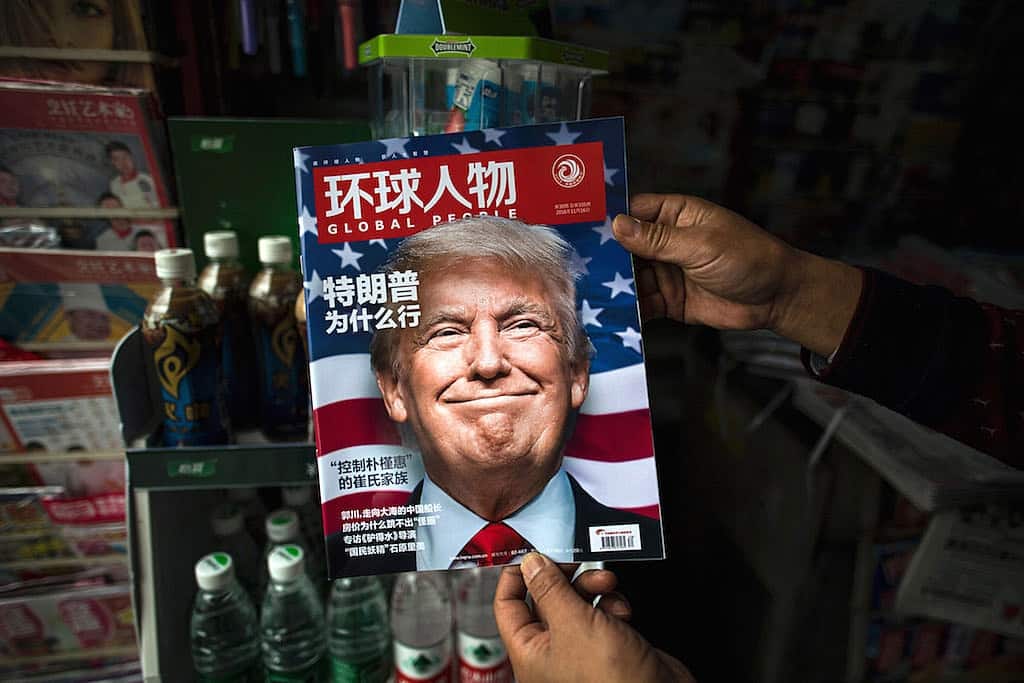 TOPSHOT - A copy of the local Chinese magazine Global People with a cover story that translates to "Why did Trump win" is seen with a front cover portrait of US president-elect Donald Trump at a news stand in Shanghai on November 14, 2016. Chinese President Xi Jinping and US president-elect Donald Trump agreed November 14 to meet "at an early date" to discuss the relationship between their two powers, Chinese state broadcaster CCTV said. / AFP / JOHANNES EISELE (Photo credit should read JOHANNES EISELE/AFP/Getty Images)