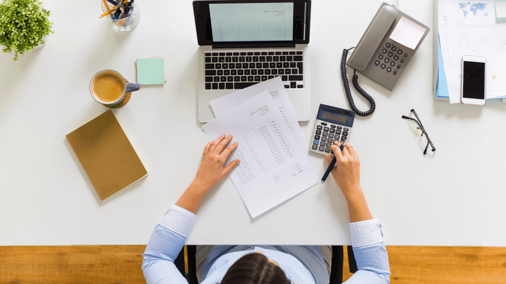 Businesswoman with tax report at office