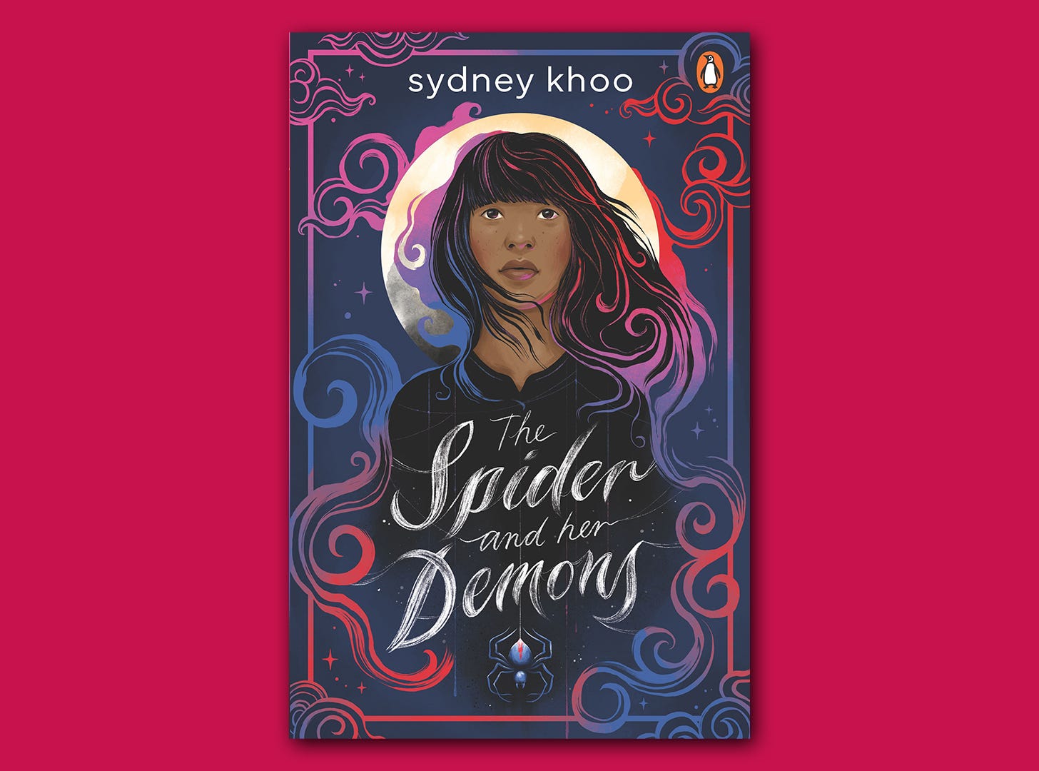 The book cover for "The Spider and her Demons" superimposed on a block hot pink background. It is an illustrated book cover showing a Malaysian Chinese girl standing in front of a white moon.