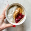 bowl of NO OATS topped with peanut butter, cranberry sauce and yogurt