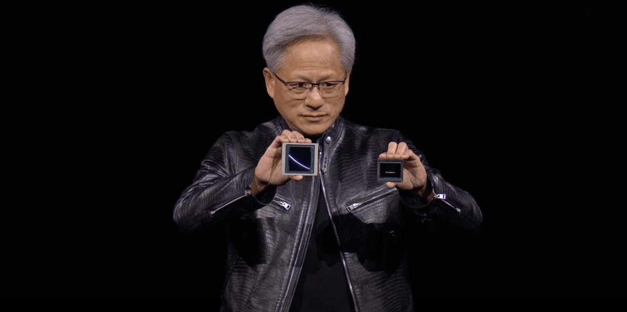 Huang holding a Hopper and Blackwell chip up for comparison