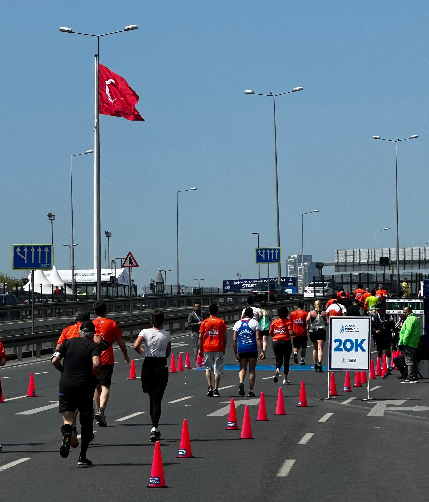 The 20K mark at the Istanbul Half Marathon with Turkish flag in background 