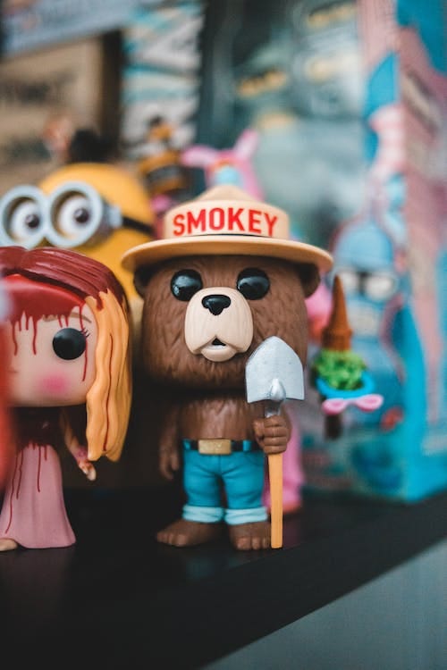 Free Mascot toy of bear on shelf Stock Photo
