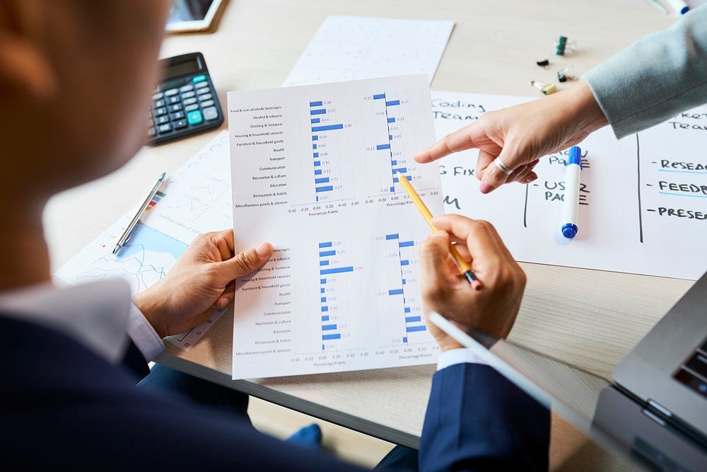 A photo of entrepreneurs pointing at compelling survey results