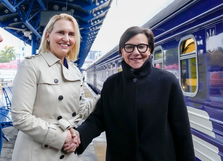 Ambassador Brink and Secretary Pritzker at a railway terminal in Kyiv.