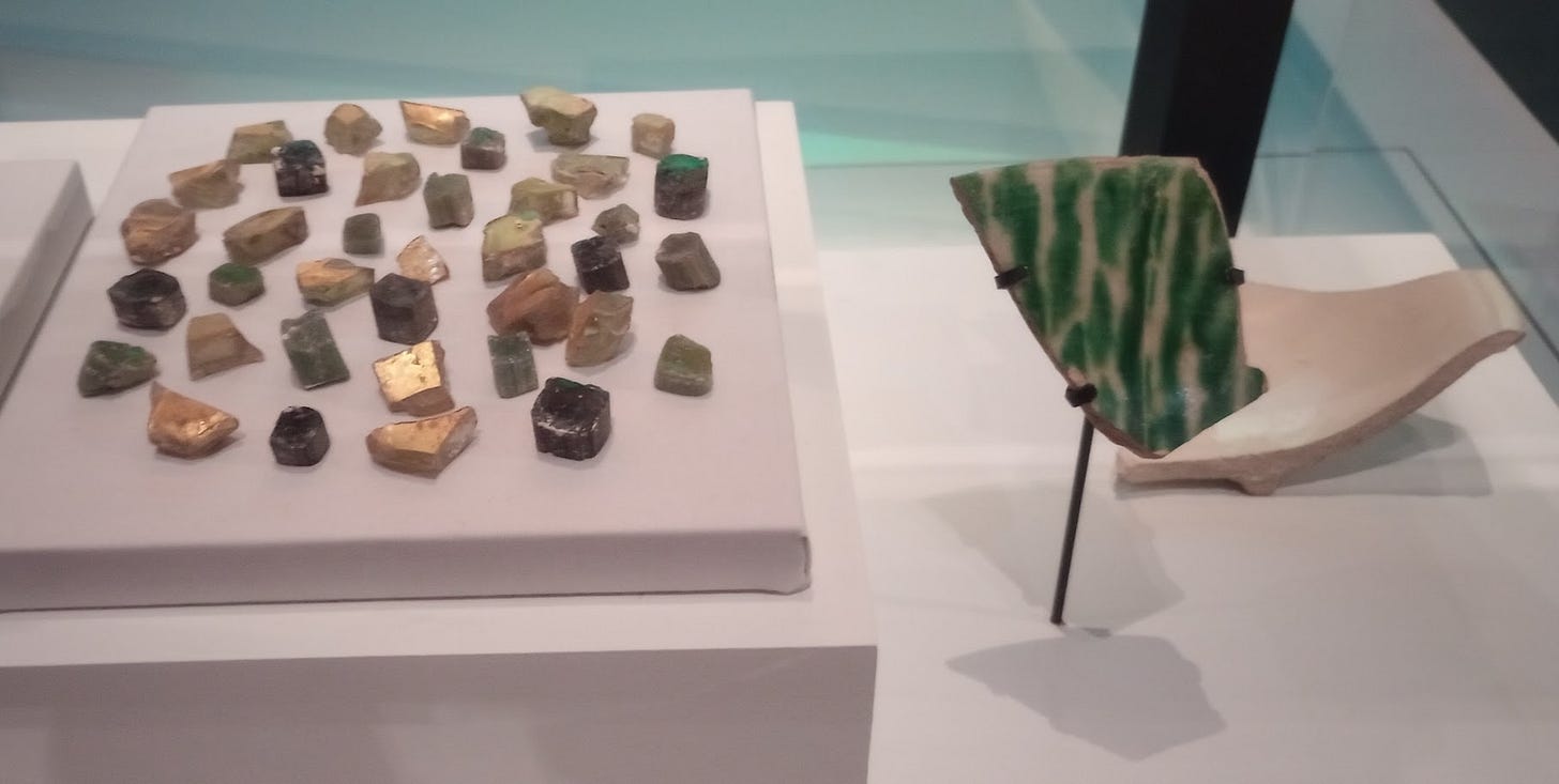 Fragments of pottery including one large gree and white one