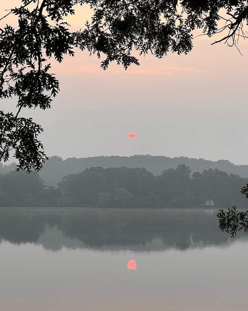 May be an image of twilight, fog, lake and horizon