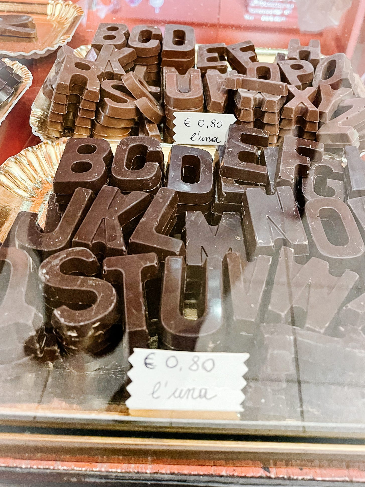 Shop display of alphabet-shaped chocolate letters in Rome. Photo by Michelle Ciani