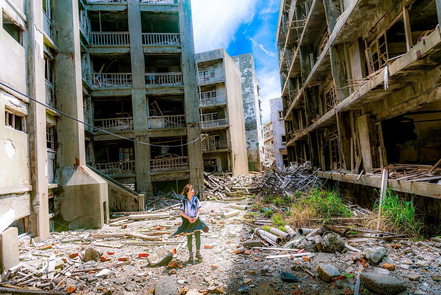 child wanders through war rubble