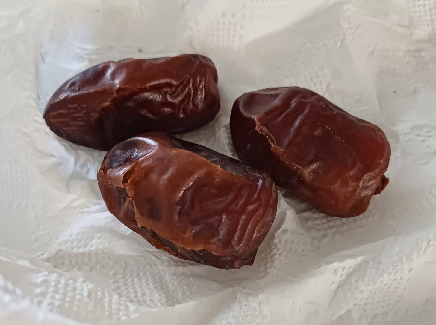 Dried dates on a paper napkin