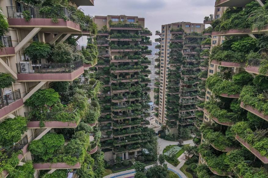 Balconies at Qiyi City Forest Garden residential buildings complex are overrun by plants in Chengdu, China