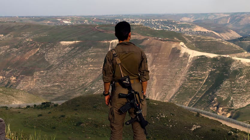 An Israeli soldier stands at a lookout point in the Israel-annexed Golan Heights overlooking south Syria, on March 25, 2025 An Israeli soldier stands at a lookout point in the Israel-annexed Golan Heights overlooking south Syria, on March 25, 2025