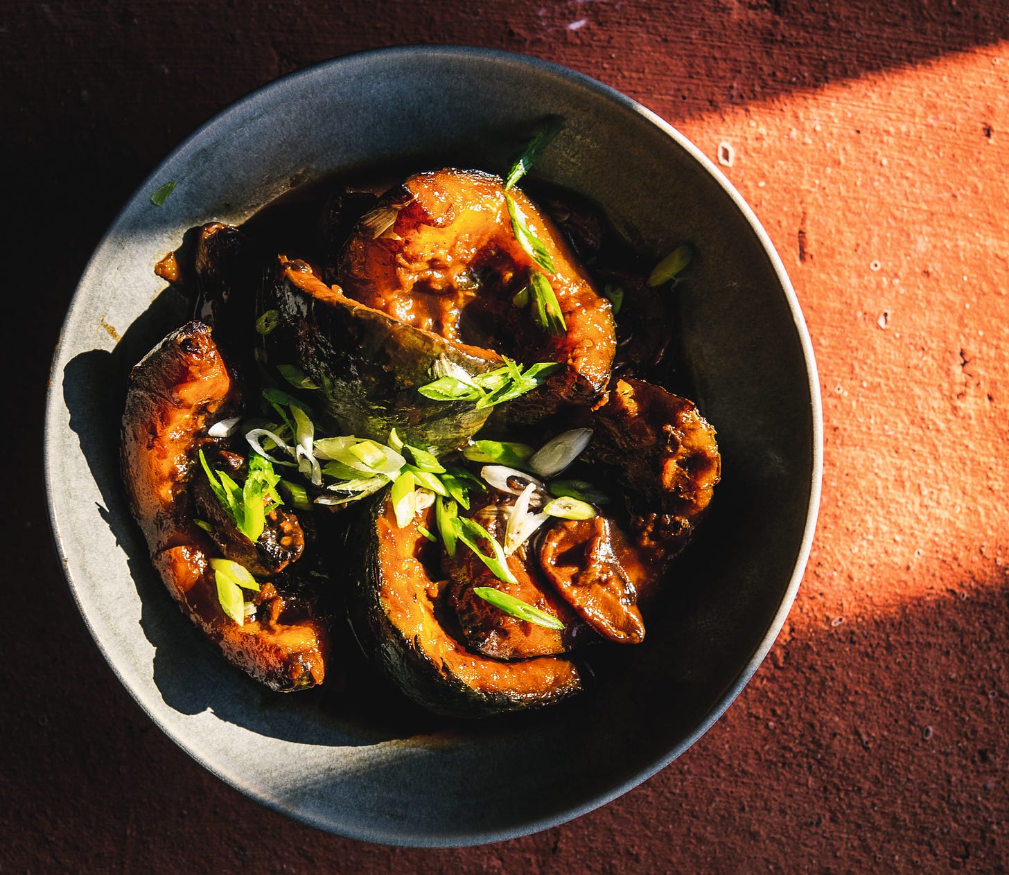 red-braised kabocha squash in a bowl