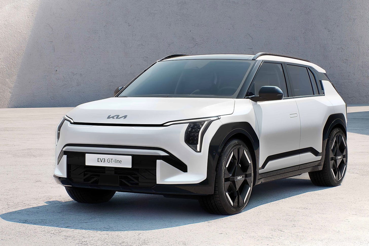 White Kia EV3 compact SUV with front plate that says GT-line