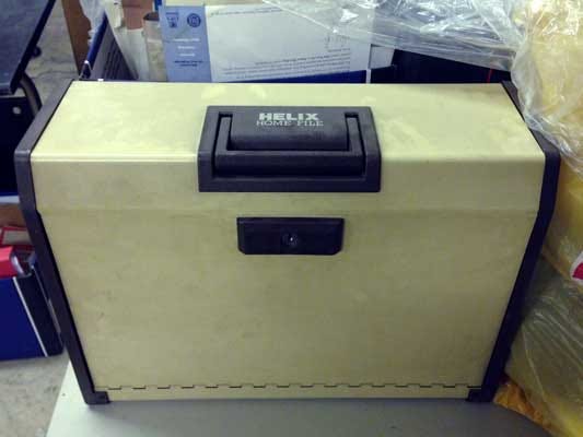Photo of a concertina document filing box, closed.