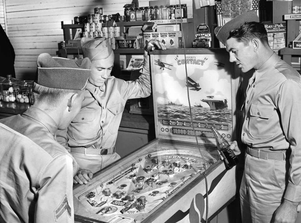 Soldiers playing pinball in 1941