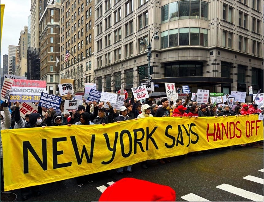 A group of people holding signs

AI-generated content may be incorrect.