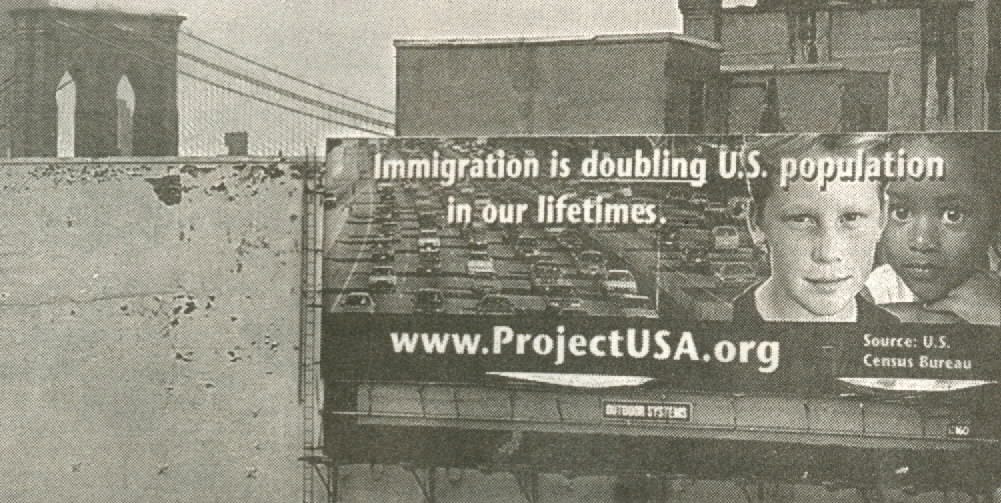 ProjectUSA billboard at the foot of the Brooklyn Bridge featuring a white boy and a black girl and the slogan: "Immigration is doubling US population within our lifetimes. Source: US Census Bureau"