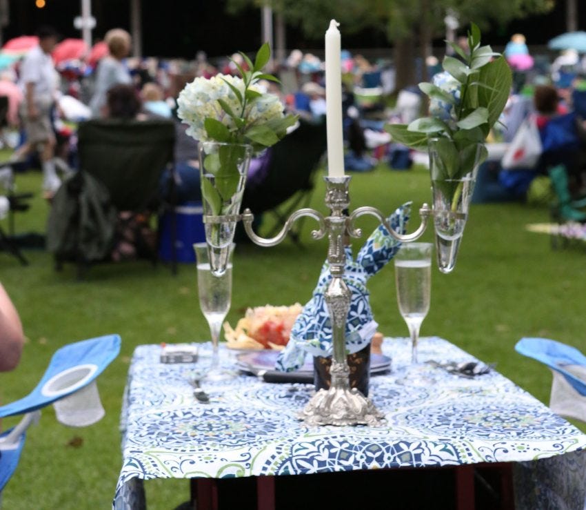 silver candelabra and champagne glasses for a picnic