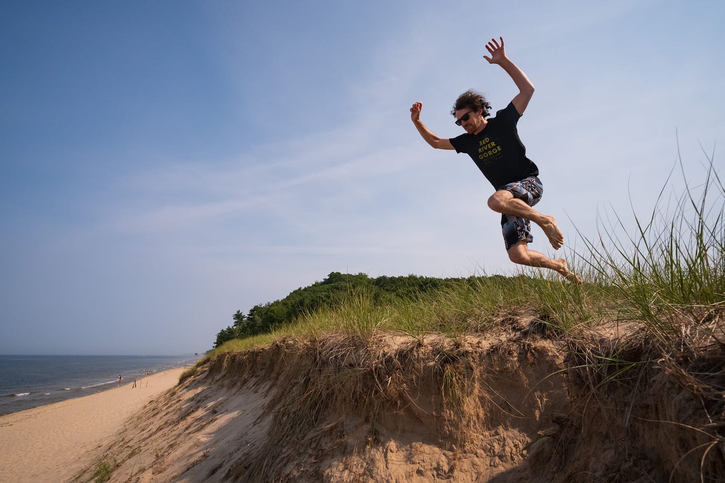 Man leaping off cliff