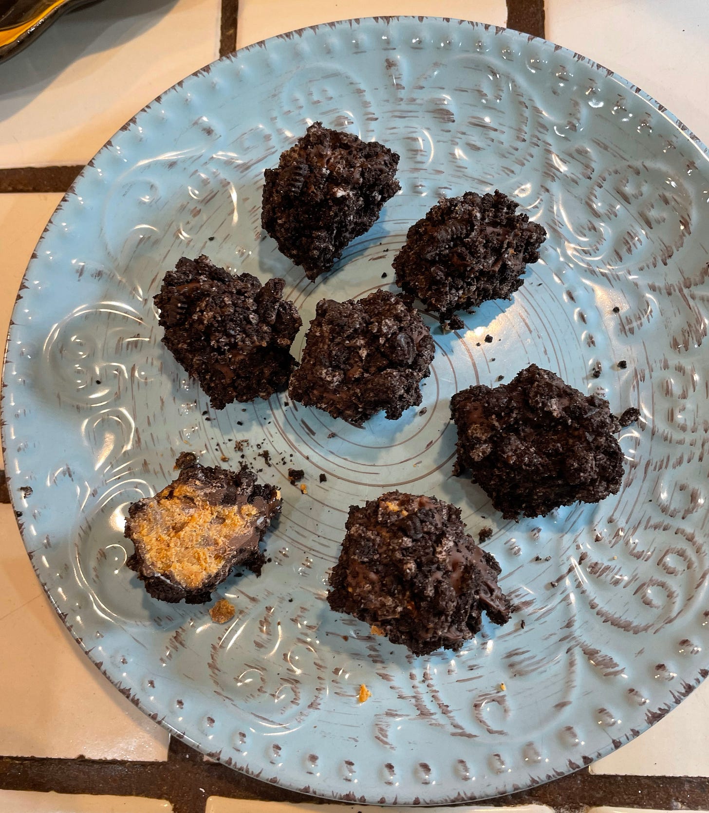 Dirt balls, with one having a bite taken out of it