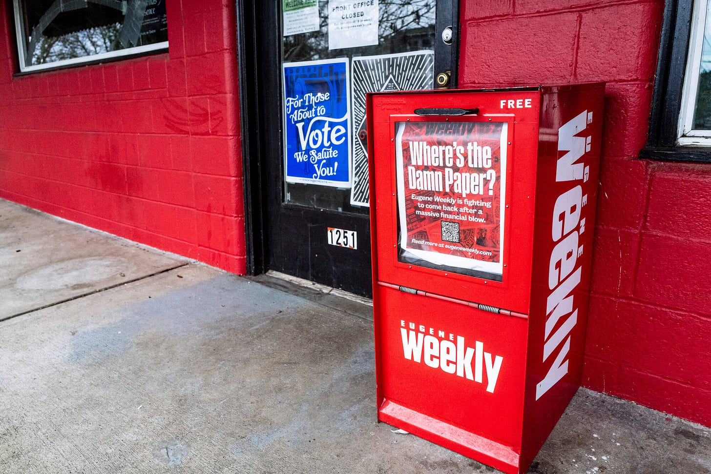 A red Eugene Weekly newspaper distributor box stands outside its office in Eugene, Oregon, on Friday, Dec. 29, 2023. The weekly newspaper had to lay off its entire staff three days before Christmas and halt print because its funds were embezzled by a former employee, its editor said. The Eugene police are investigating and the paper's owners have hired forensic accountants to piece together what happened. A red Eugene Weekly newspaper distributor box stands outside its office in Eugene, Oregon, on Friday, Dec. 29, 2023. The weekly newspaper had to lay off its entire staff three days before Christmas and halt print because its funds were embezzled by a former employee, its editor said. The Eugene police are investigating and the paper's owners have hired forensic accountants to piece together what happened.