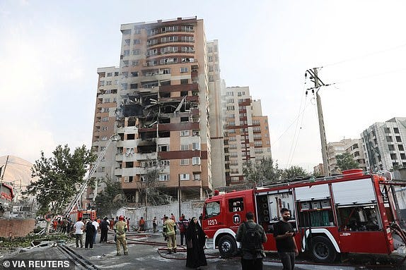 Firefighters work at the scene of a damaged building in the aftermath of Israeli strikes, in Tehran, Iran, June 13, 2025. Majid Asgaripour/WANA (West Asia News Agency) via REUTERS   ATTENTION EDITORS - THIS PICTURE WAS PROVIDED BY A THIRD PARTY     TPX IMAGES OF THE DAY