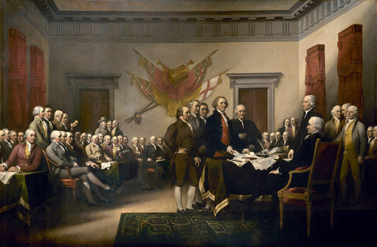 The artist's recreation of the Declaration signing with portraits of the entire Second Congress, as though all members were present. The Committee of Five are standing centered together presenting a parchment on the table.