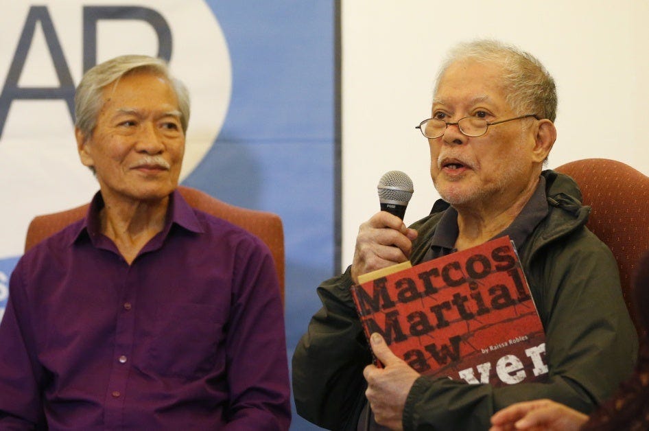 Human rights lawyer and former senator Rene Saguisag holds a copy of a book about the martial law period in the Philippines while describing his ordeal in detention, Manila, September 26, 2018. 