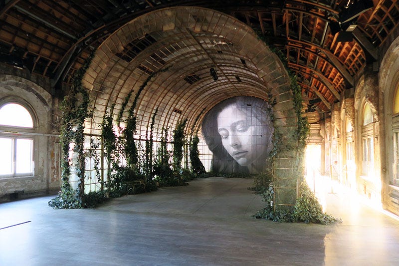 Inside the Ballroom at Flinders Street Station, with one of RONE's installations and murals.