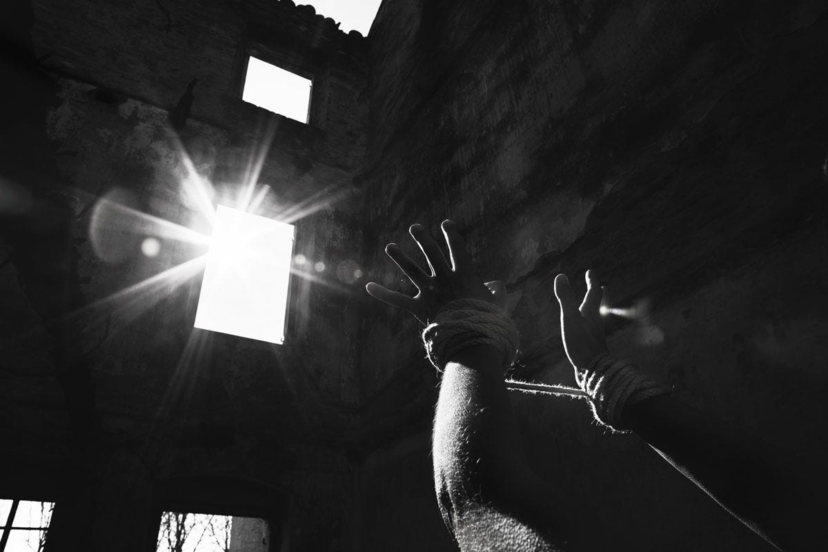 Prisoner Reaching for the Light in the Window